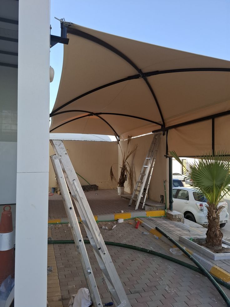 تركيب مظلات سيارات قماش في حي العوالي مكة بتصميم عصري